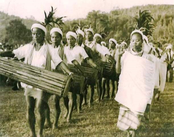 Archive photo from Year 1976 showing dancers and drummers in a line