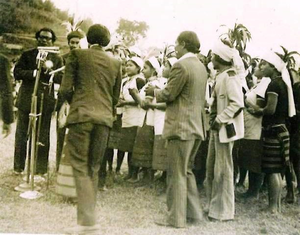 Archive photo from Year 1976 showing performers gathered near a recording setup